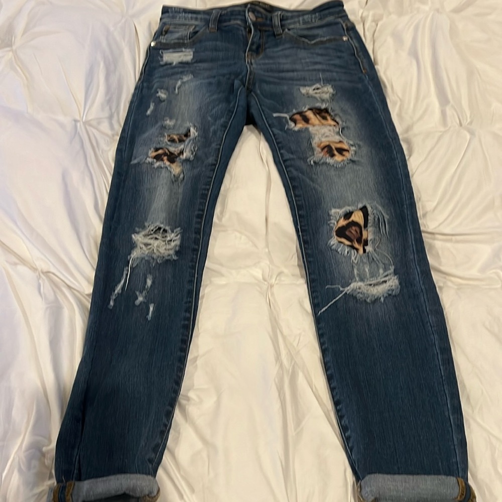Stretchy skinny jeans with animal print patches.